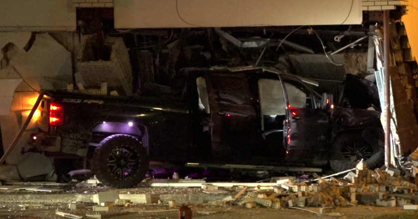 Shooting suspect crashes into building