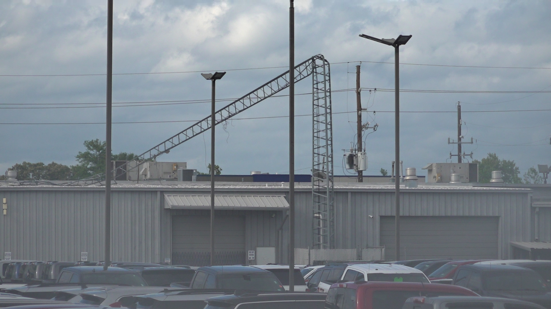 Hurricane Beryl Cell phone tower landed on car dealership in Humble