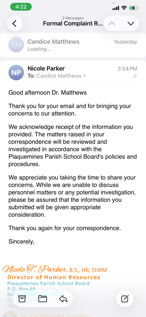 Mobile email app: reply from Nicole Parker to Candice Matthews about a formal complaint; shows greeting and opening paragraph of the response.